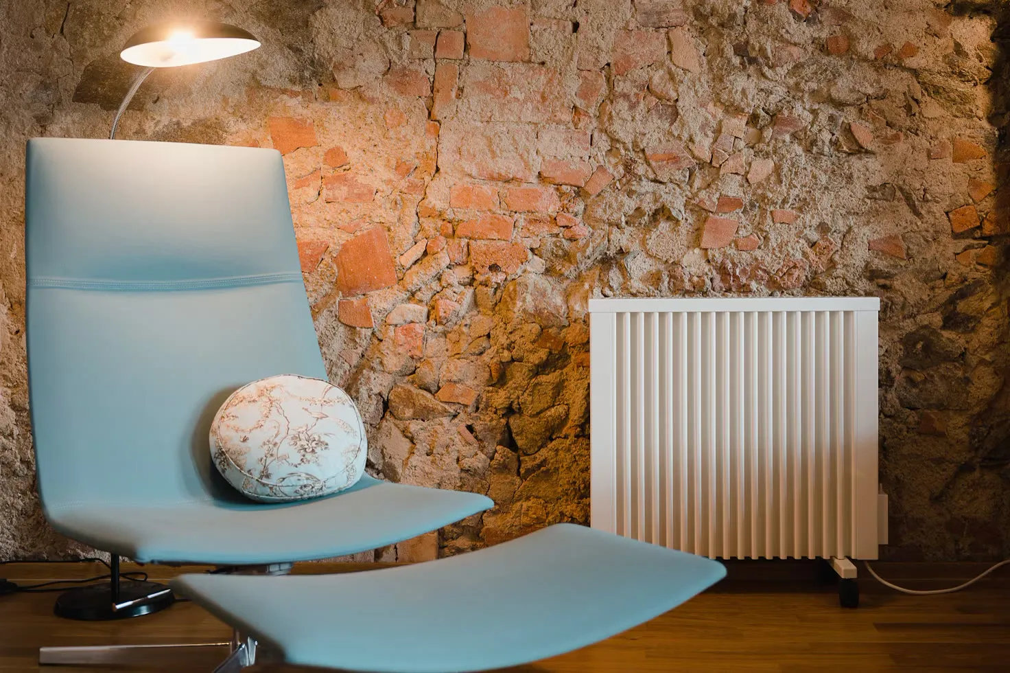 A radiator under a window in a warm room